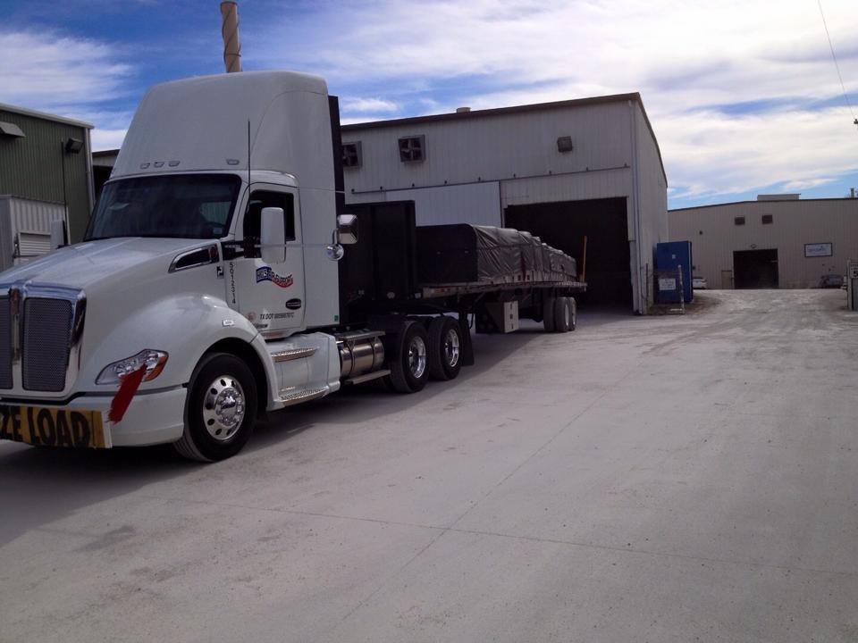 Hills Air Support tractor with flatbed freight